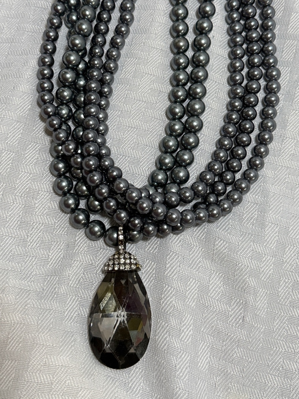 Multi-Strand Faux Pearl Necklace with Black Crystal Teardrop Pendant